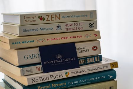 Stack of therapy and hypnotherapy books